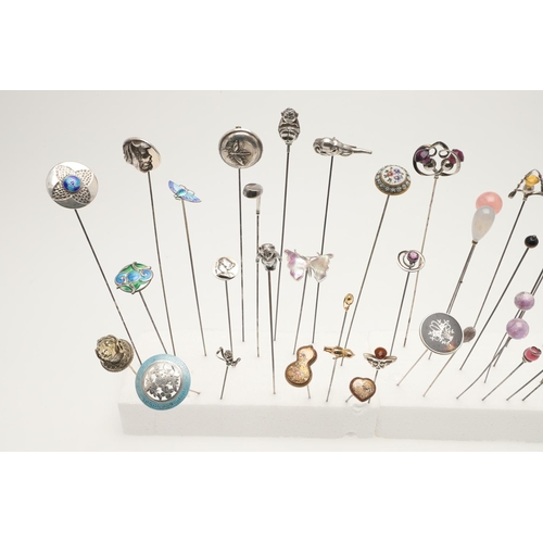 89 - A COLLECTION OF SIXTY-TWO VARIOUS HAT PINS. including examples decorated with enamel, animals & inse... 