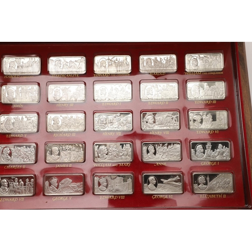 97 - AN ELIZABETH II CASED SET OF FIFTY COMMEMORATIVE SILVER INGOTS. of rectangular form, each depicting ... 