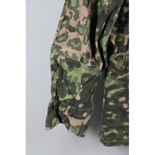 A SECOND WORLD WAR GERMAN WAFFEN-SS REVERSIBLE CAMOUFLAGE SMOCK. A ...