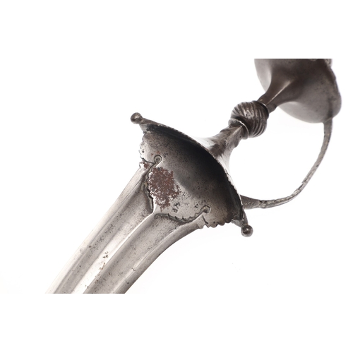 106 - A LATE 17TH CENTURY SOUTH INDIAN CHILANUM DAGGER. The 28 cm pointed gently curved blade with a centr... 