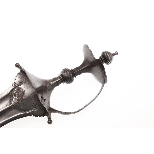 106 - A LATE 17TH CENTURY SOUTH INDIAN CHILANUM DAGGER. The 28 cm pointed gently curved blade with a centr... 