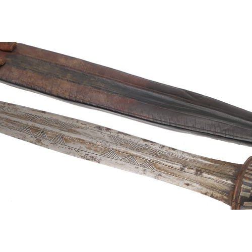 108 - A NEAR IDENTICAL PAIR OF SUDANESE KNIVES AND SCABBARDS. The two blades 32 cm and 30 cm, with curved ... 