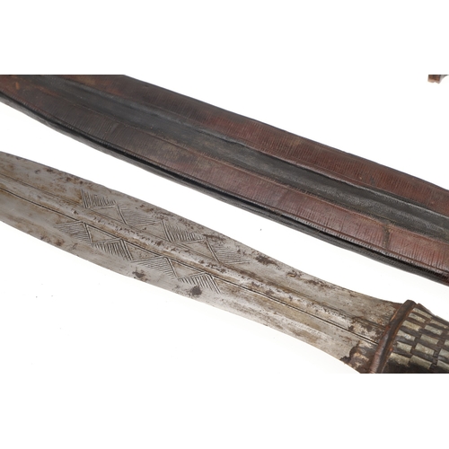 108 - A NEAR IDENTICAL PAIR OF SUDANESE KNIVES AND SCABBARDS. The two blades 32 cm and 30 cm, with curved ... 