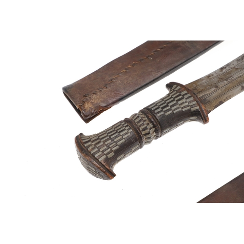 108 - A NEAR IDENTICAL PAIR OF SUDANESE KNIVES AND SCABBARDS. The two blades 32 cm and 30 cm, with curved ... 