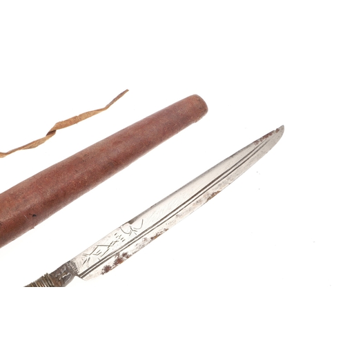 116 - A SOUTH ALGERIAN BOU SADDI KNIFE AND SCABBARD. The 13.5 cm slender pointed blade with engraved decor... 