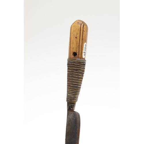 116 - A SOUTH ALGERIAN BOU SADDI KNIFE AND SCABBARD. The 13.5 cm slender pointed blade with engraved decor... 