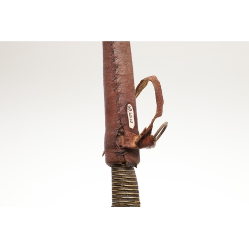 116 - A SOUTH ALGERIAN BOU SADDI KNIFE AND SCABBARD. The 13.5 cm slender pointed blade with engraved decor... 