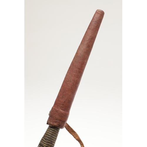 116 - A SOUTH ALGERIAN BOU SADDI KNIFE AND SCABBARD. The 13.5 cm slender pointed blade with engraved decor... 