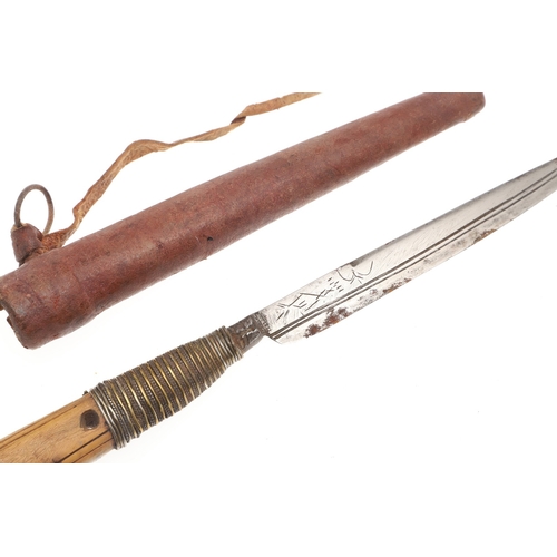 116 - A SOUTH ALGERIAN BOU SADDI KNIFE AND SCABBARD. The 13.5 cm slender pointed blade with engraved decor... 