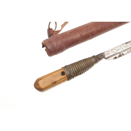 116 - A SOUTH ALGERIAN BOU SADDI KNIFE AND SCABBARD. The 13.5 cm slender pointed blade with engraved decor... 