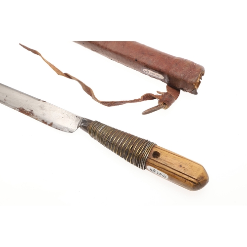 116 - A SOUTH ALGERIAN BOU SADDI KNIFE AND SCABBARD. The 13.5 cm slender pointed blade with engraved decor... 