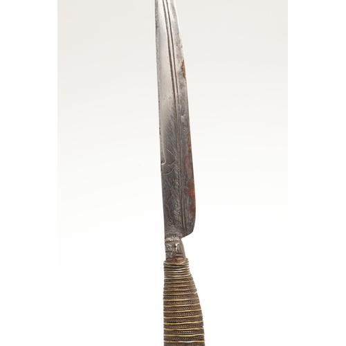 116 - A SOUTH ALGERIAN BOU SADDI KNIFE AND SCABBARD. The 13.5 cm slender pointed blade with engraved decor... 