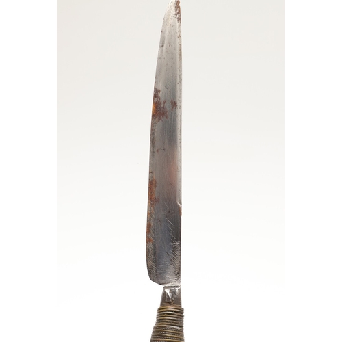 116 - A SOUTH ALGERIAN BOU SADDI KNIFE AND SCABBARD. The 13.5 cm slender pointed blade with engraved decor... 