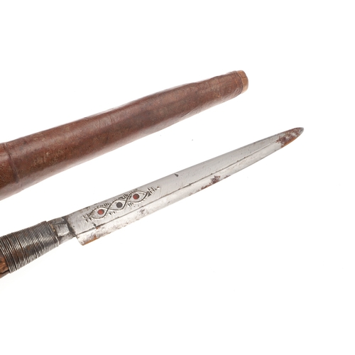 117 - A SOUTH ALGERIAN BOU SADDI KNIFE AND SCABBARD. The 13.5 cm pointed blade with red dot decoration, on... 
