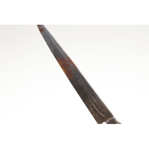 117 - A SOUTH ALGERIAN BOU SADDI KNIFE AND SCABBARD. The 13.5 cm pointed blade with red dot decoration, on... 