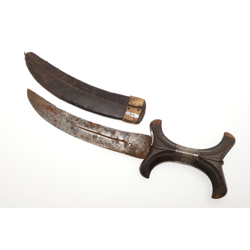 118 - A BEDJA ERITREAN KNIFE WITH X FORM HANDLE. The 20 cm hooked blade with a pointed tip sharpened to bo... 