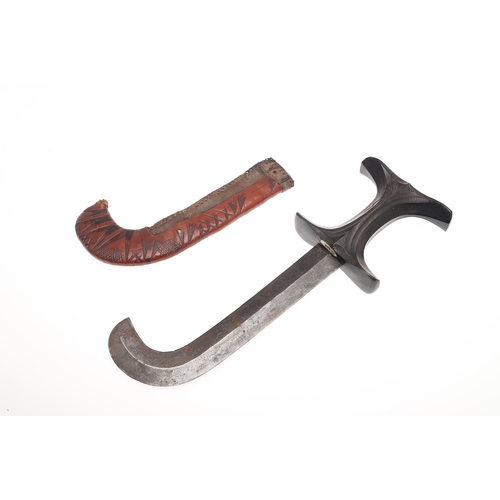 119 - A BEDJA ERITREAN KNIFE WITH 'X' FORM HANDLE. The knife having a 21 cm hooked blade sharpened to both... 