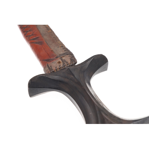 119 - A BEDJA ERITREAN KNIFE WITH 'X' FORM HANDLE. The knife having a 21 cm hooked blade sharpened to both... 