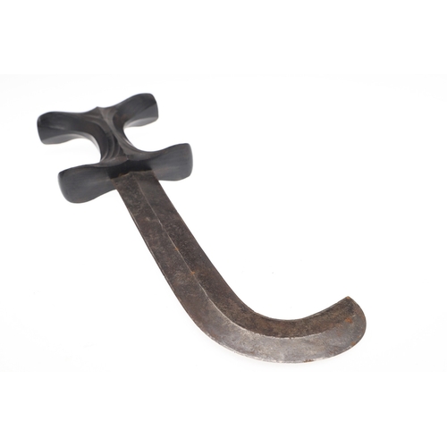 119 - A BEDJA ERITREAN KNIFE WITH 'X' FORM HANDLE. The knife having a 21 cm hooked blade sharpened to both... 