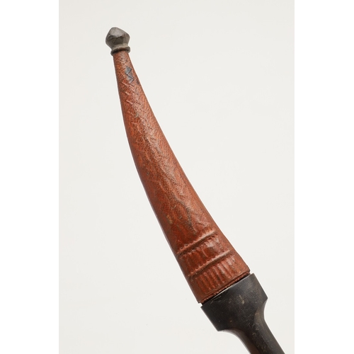 139 - A DAGGER AND SCABBARD, POSSIBLY MARSH ARAB. The short 14 cm curved, pointed and double edged blade w... 