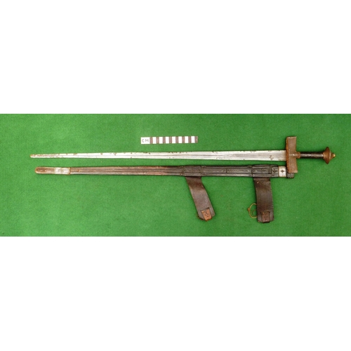 160 - A TAKOUBA SWORD AND SCABBARD OF THE TUAREG PEOPLE. The 79 cm straight tapering blade with rounded po... 