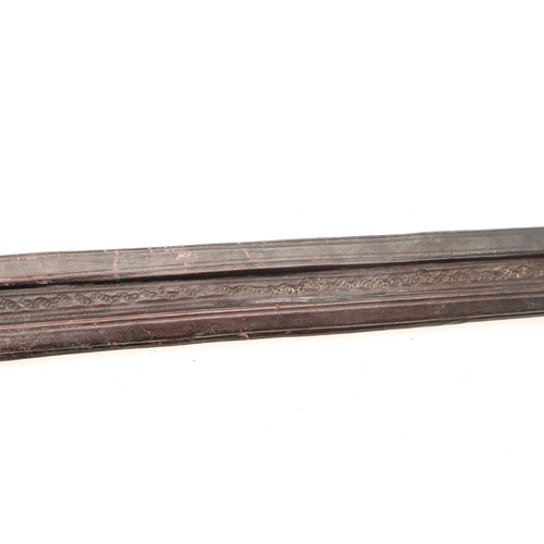 160 - A TAKOUBA SWORD AND SCABBARD OF THE TUAREG PEOPLE. The 79 cm straight tapering blade with rounded po... 