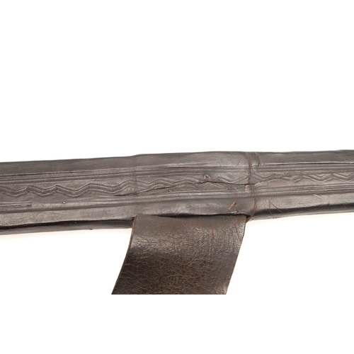 160 - A TAKOUBA SWORD AND SCABBARD OF THE TUAREG PEOPLE. The 79 cm straight tapering blade with rounded po... 
