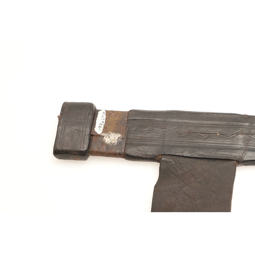 160 - A TAKOUBA SWORD AND SCABBARD OF THE TUAREG PEOPLE. The 79 cm straight tapering blade with rounded po... 