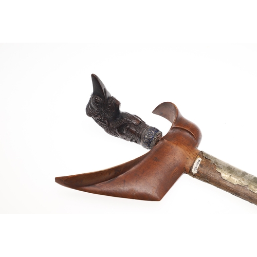 37 - A 19TH CENTURY JEWEL ENCRUSTED KRIS AND SCABBARD. The 34 cm blade with ten curves and pamor in the '... 