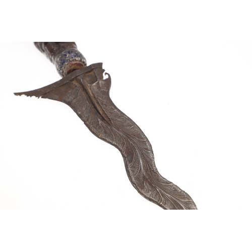 37 - A 19TH CENTURY JEWEL ENCRUSTED KRIS AND SCABBARD. The 34 cm blade with ten curves and pamor in the '... 