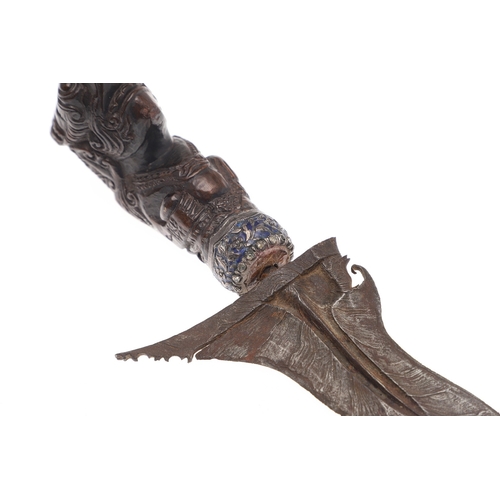 37 - A 19TH CENTURY JEWEL ENCRUSTED KRIS AND SCABBARD. The 34 cm blade with ten curves and pamor in the '... 