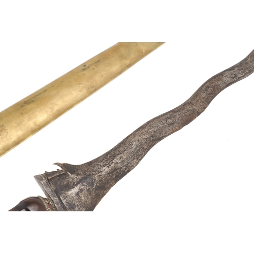 38 - A 19TH CENTURY 'JEWEL' MOUNTED JAVANESE KRIS AND SCABBARD. The 35.5 cm blade with eight curves and p... 