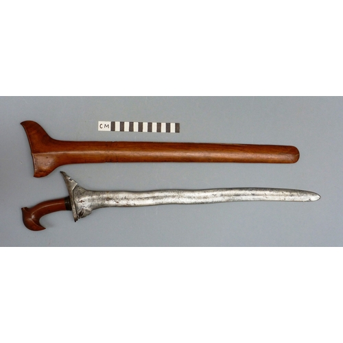 40 - A PHILIPPINES KRIS SUNDANG AND SCABBARD. The 53 cm blade with six or seven faint curves and a centra... 