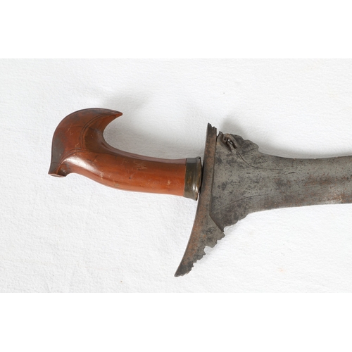 40 - A PHILIPPINES KRIS SUNDANG AND SCABBARD. The 53 cm blade with six or seven faint curves and a centra... 