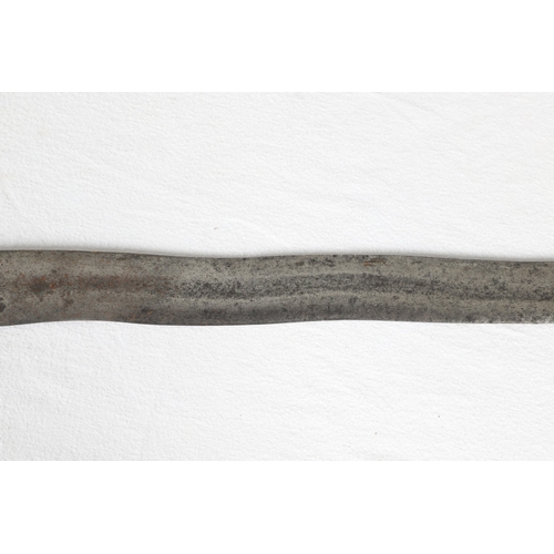 40 - A PHILIPPINES KRIS SUNDANG AND SCABBARD. The 53 cm blade with six or seven faint curves and a centra... 