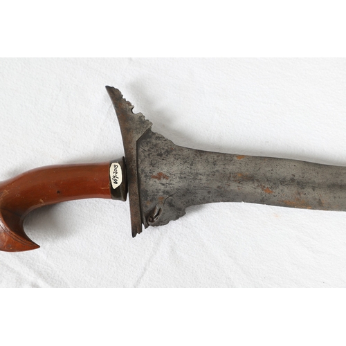 40 - A PHILIPPINES KRIS SUNDANG AND SCABBARD. The 53 cm blade with six or seven faint curves and a centra... 
