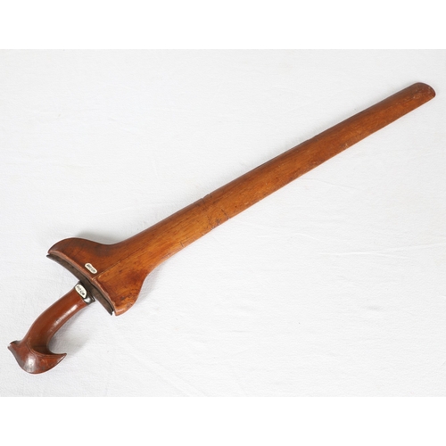 40 - A PHILIPPINES KRIS SUNDANG AND SCABBARD. The 53 cm blade with six or seven faint curves and a centra... 
