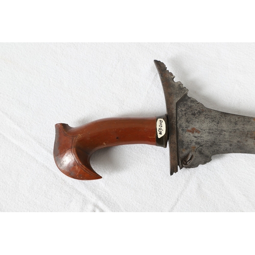 40 - A PHILIPPINES KRIS SUNDANG AND SCABBARD. The 53 cm blade with six or seven faint curves and a centra... 