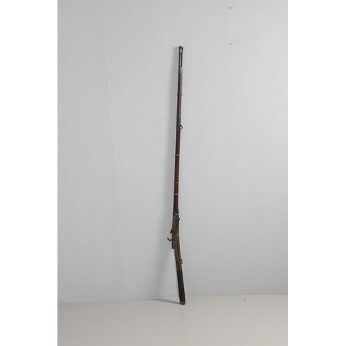 6 - A MATCHLOCK MUSKET, TORADAR INDIA. The 125 cm tapering barrel with deep brown patination, approximat... 