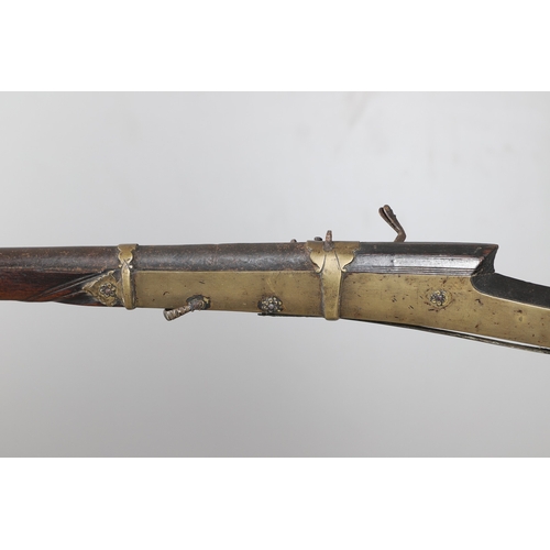 6 - A MATCHLOCK MUSKET, TORADAR INDIA. The 125 cm tapering barrel with deep brown patination, approximat... 
