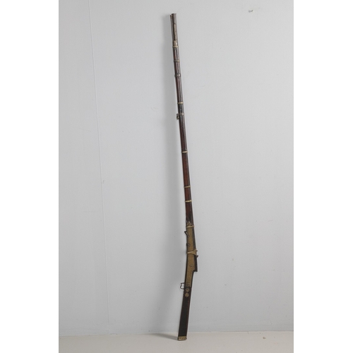 6 - A MATCHLOCK MUSKET, TORADAR INDIA. The 125 cm tapering barrel with deep brown patination, approximat... 