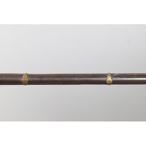 6 - A MATCHLOCK MUSKET, TORADAR INDIA. The 125 cm tapering barrel with deep brown patination, approximat... 