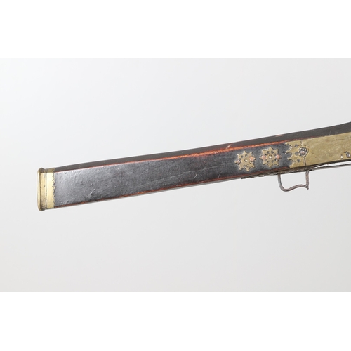 6 - A MATCHLOCK MUSKET, TORADAR INDIA. The 125 cm tapering barrel with deep brown patination, approximat... 