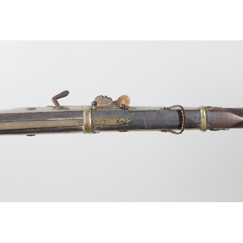 6 - A MATCHLOCK MUSKET, TORADAR INDIA. The 125 cm tapering barrel with deep brown patination, approximat... 