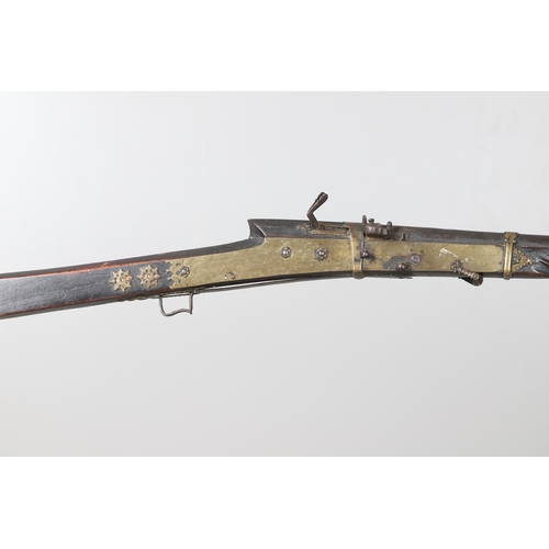 6 - A MATCHLOCK MUSKET, TORADAR INDIA. The 125 cm tapering barrel with deep brown patination, approximat... 