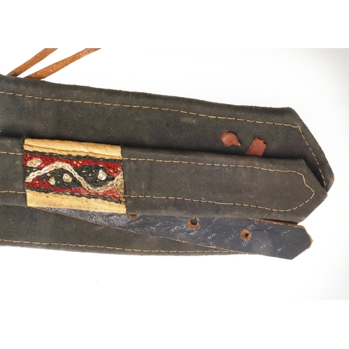 63 - A YEMENI JANABI KNIFE AND SCABBARD ON THE ORIGINAL BROAD BELT. The knife with a 22 cm curved blade w... 