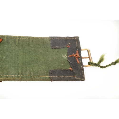 63 - A YEMENI JANABI KNIFE AND SCABBARD ON THE ORIGINAL BROAD BELT. The knife with a 22 cm curved blade w... 