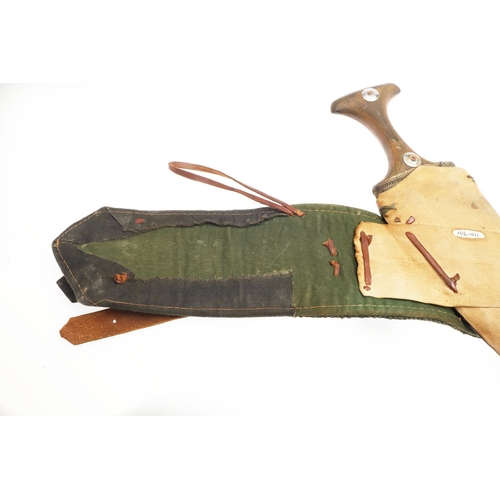 63 - A YEMENI JANABI KNIFE AND SCABBARD ON THE ORIGINAL BROAD BELT. The knife with a 22 cm curved blade w... 