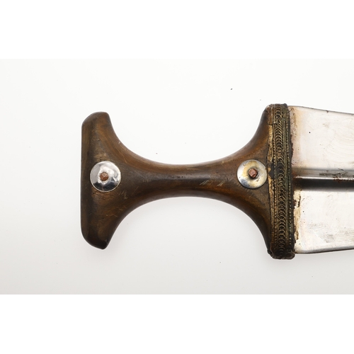 63 - A YEMENI JANABI KNIFE AND SCABBARD ON THE ORIGINAL BROAD BELT. The knife with a 22 cm curved blade w... 
