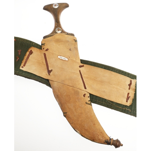 63 - A YEMENI JANABI KNIFE AND SCABBARD ON THE ORIGINAL BROAD BELT. The knife with a 22 cm curved blade w... 